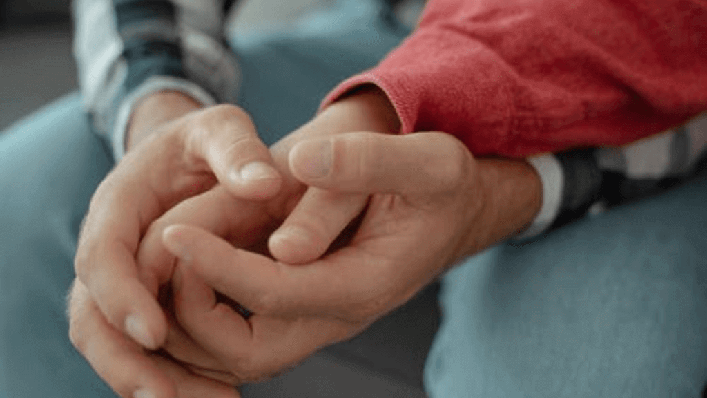 couple hands holding each other trailblazer alzheimer's study