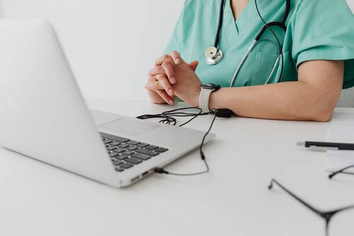 medical professional in front of her laptop bradenton research center